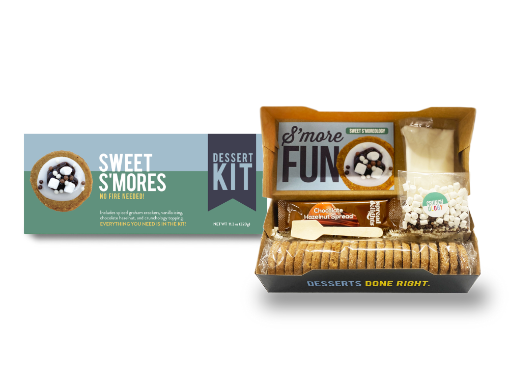 Packaging of Sweet S'mores Dessert Kit showing the box and contents including graham cracker cookies, vanilla and chocolate hazelnut schmears, and marshmallows.