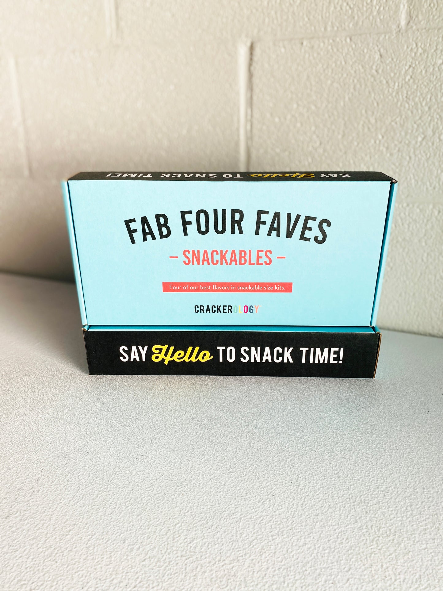 Out side of the box that says Fab Four Faves Snackables