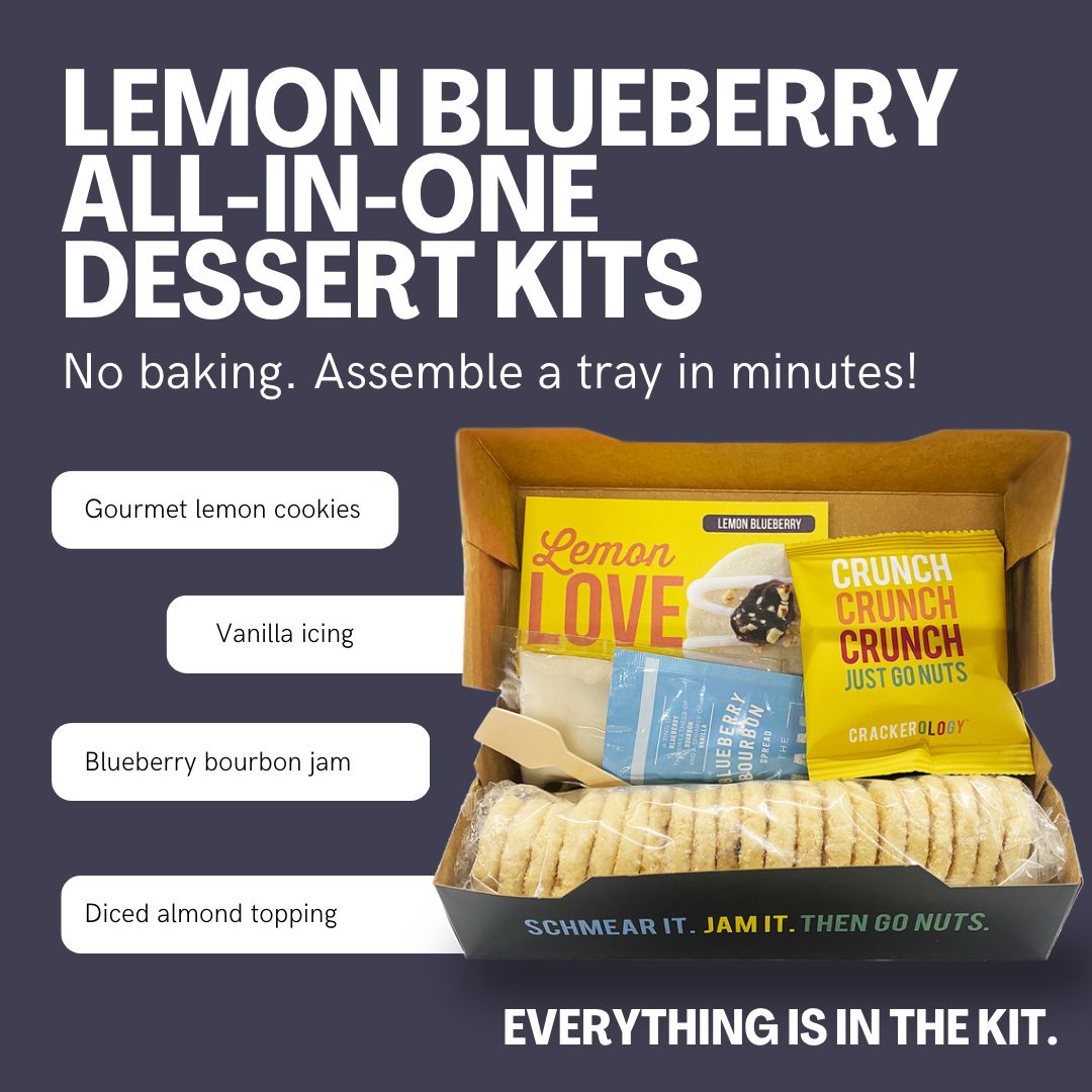 Packaging for Lemon Blueberry dessert kit, showing the box and contents including lemon shortbread cookies, icing,  blueberry bourbon jam and an almond topping.