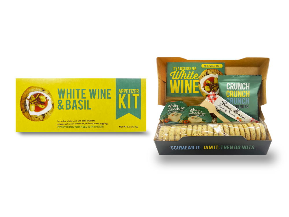 Packaging for White Wine & Basil Appetizer Kit, showing boxes with crackers and additional ingredients.